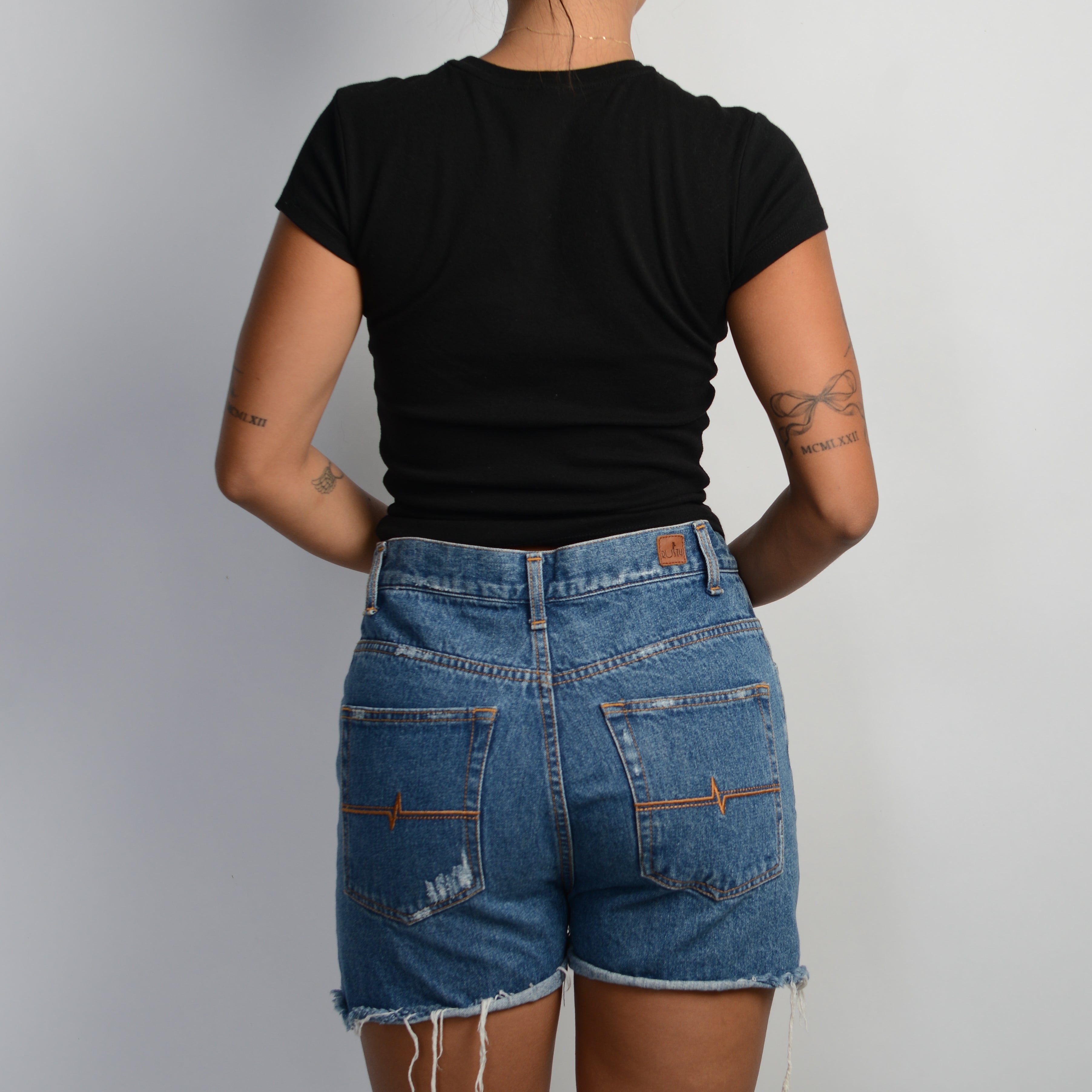 DISTRESSED DENIM SHORTS