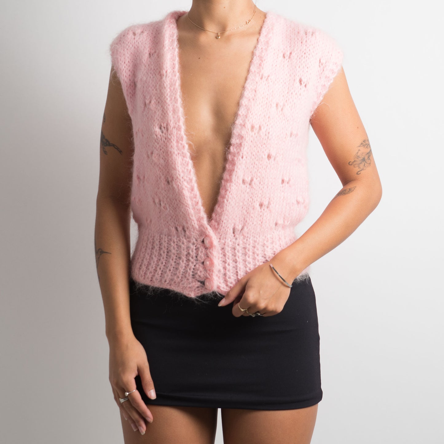 GILET EN TRICOT ROSE