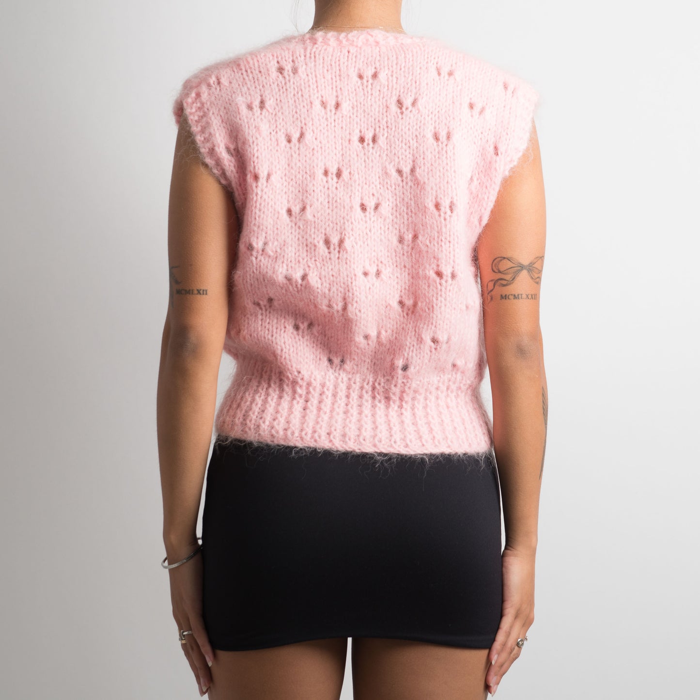 GILET EN TRICOT ROSE